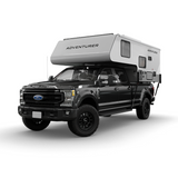Black Ford truck with an Adventurer 80RB truck camper on a white background